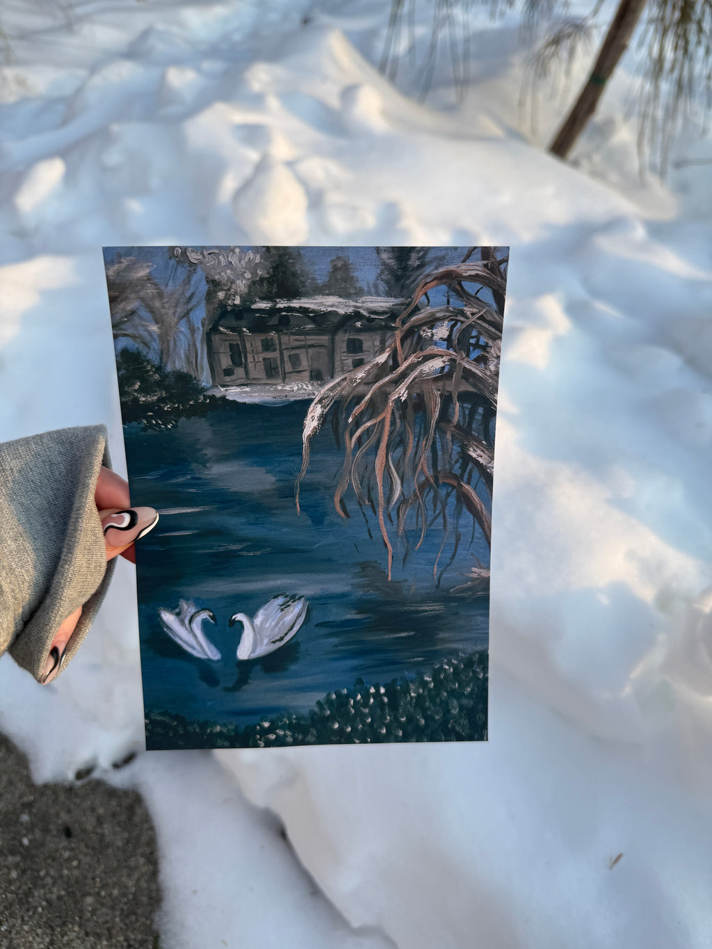 Winter scene with snow-covered ground and a small house in the background